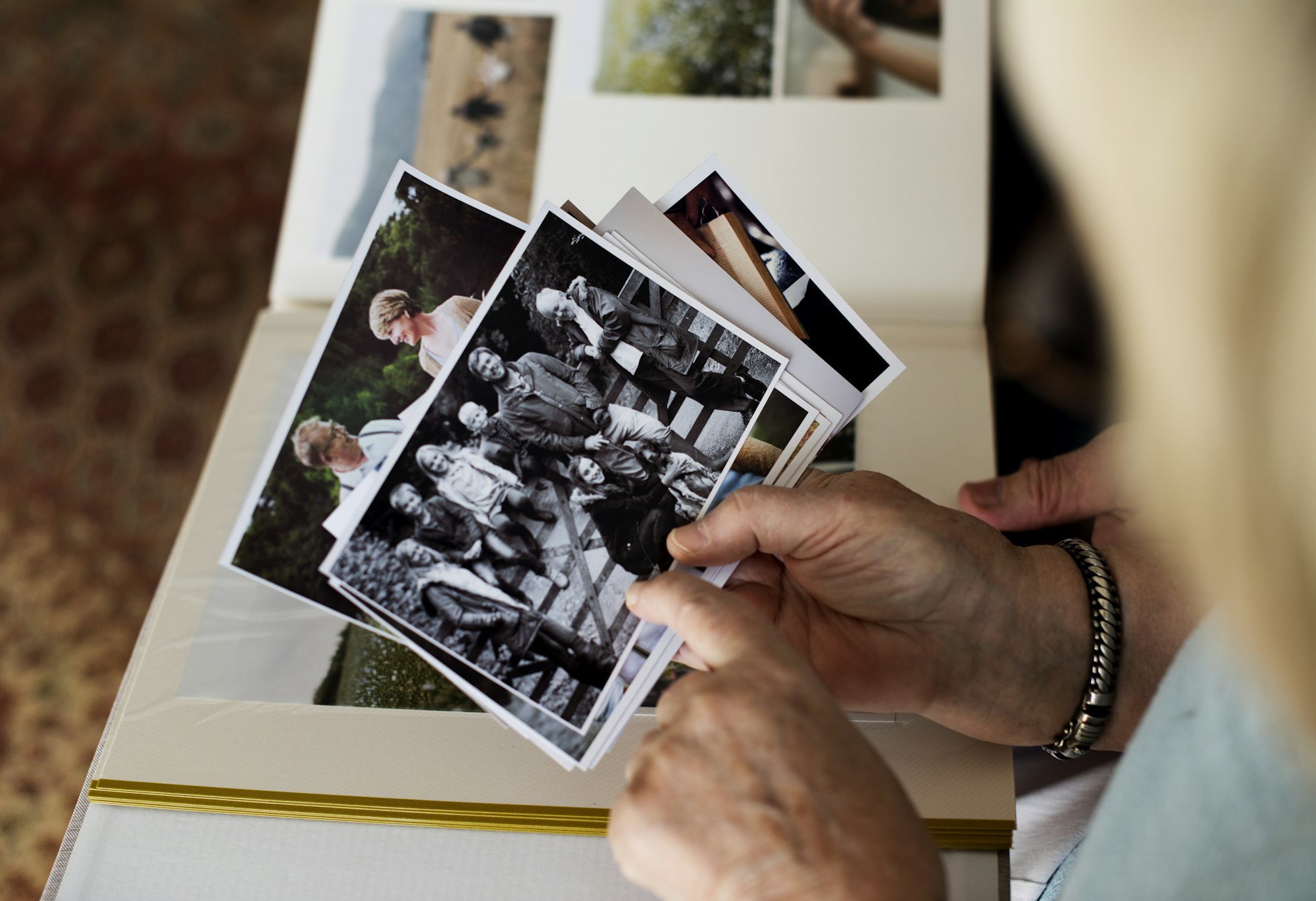 Senior couple looking at family photo album